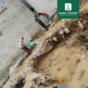 Engineers identifying water sources at a construction site in Kogilu before excavation, crucial for stabilizing waterlogged soil.